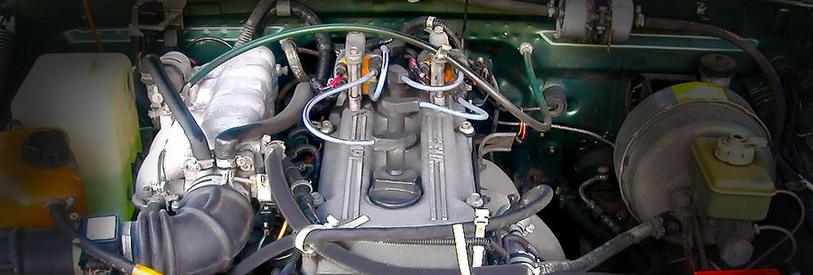 2.3-литровый бензиновый силовой агрегат ЗМЗ 406 под капотом ГАЗ 31105.