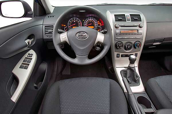 Седан Тойота Королла Америка 10 (Е140) интерьер торпедо до обновления