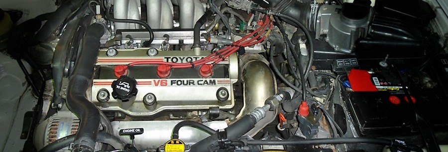2.0-литровый бензиновый силовой агрегат 1VZ-FE под капотом Тойота Камри.